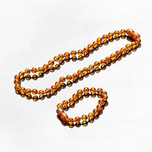 Load image into Gallery viewer, Baby&#39;s Amber Natural Teething Necklace and Bracelet Set, Cognac - BabysAmber.com
